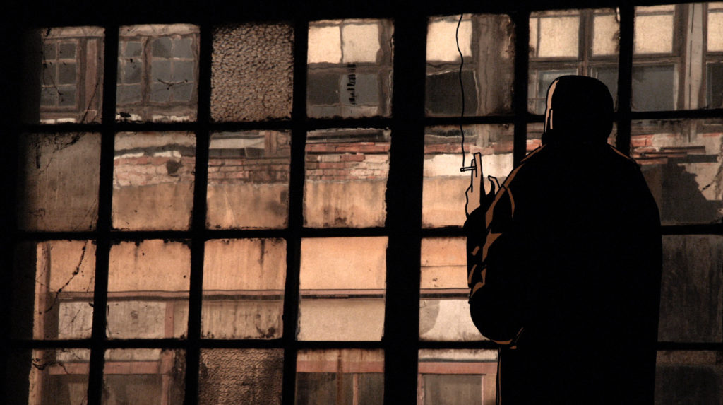 Igor Grubić HOW STEEL WAS TEMPERED, 2018. Image shows a still from the video depicting a man smoking inside a derelict factory.