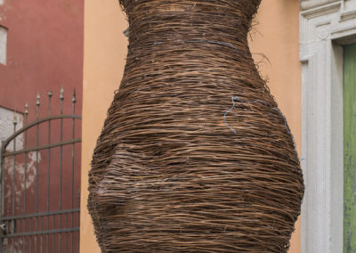 Tanja Helena Roscic, Man in the Bottle, 2023. Metal and willow sculpture on the pavement outside an ancient chapel in Labin.